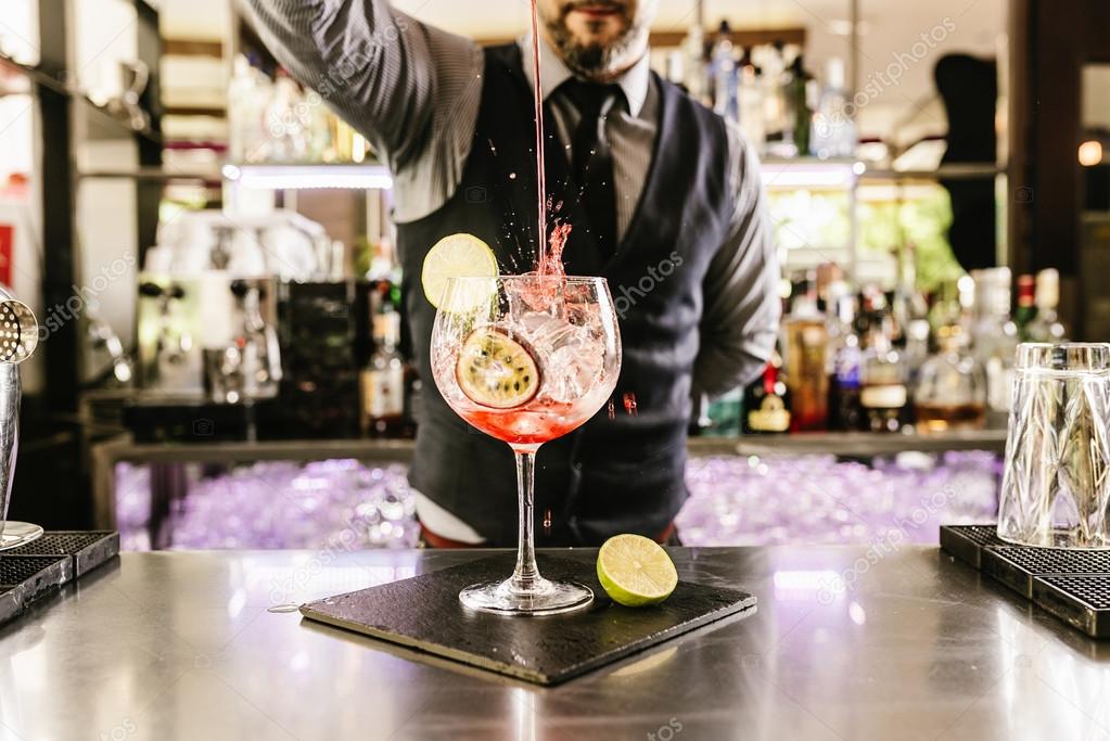 depositphotos_113885240-stock-photo-barman-is-making-cocktail-at