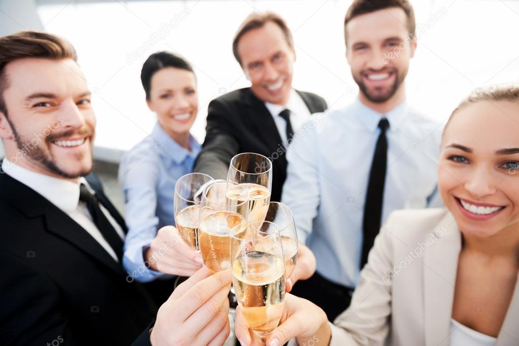 depositphotos 59814565 stock photo business people toasting with champagne 1